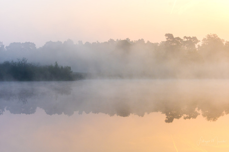 Misty sunrise at the lake