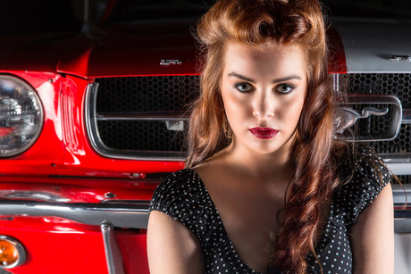 beauty in front of a Mustang