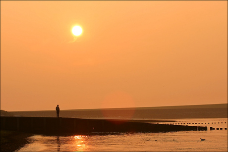 Zonsondergang aan de Maas