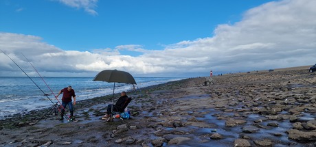 Straatfotografie vissers aan zee