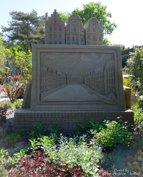 Amsterdamse huisjes met een schilderij van de Amsterdamse Grachten