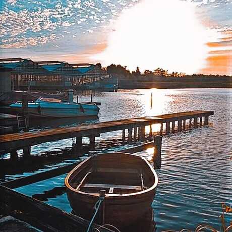 Zonsondergang met een bootje