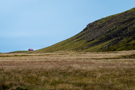 Klein huisje, grote berg