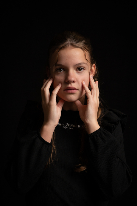 A moment of stillness, where vulnerability and strength quietly meet.