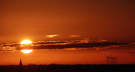 de opkomende zon................................