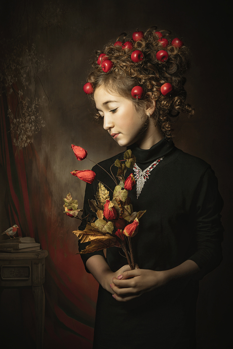 Het meisje met de rodel appeltjes in haar haar.