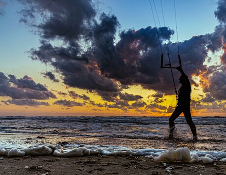 Kitesurfing with sunset...