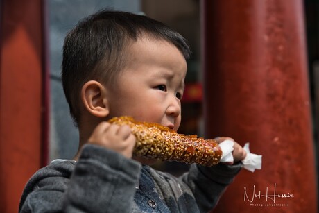 A big snack for a young boy