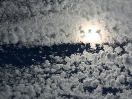 white clouds blue sky backlight